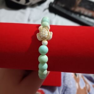 Light blue bracelet with turtle